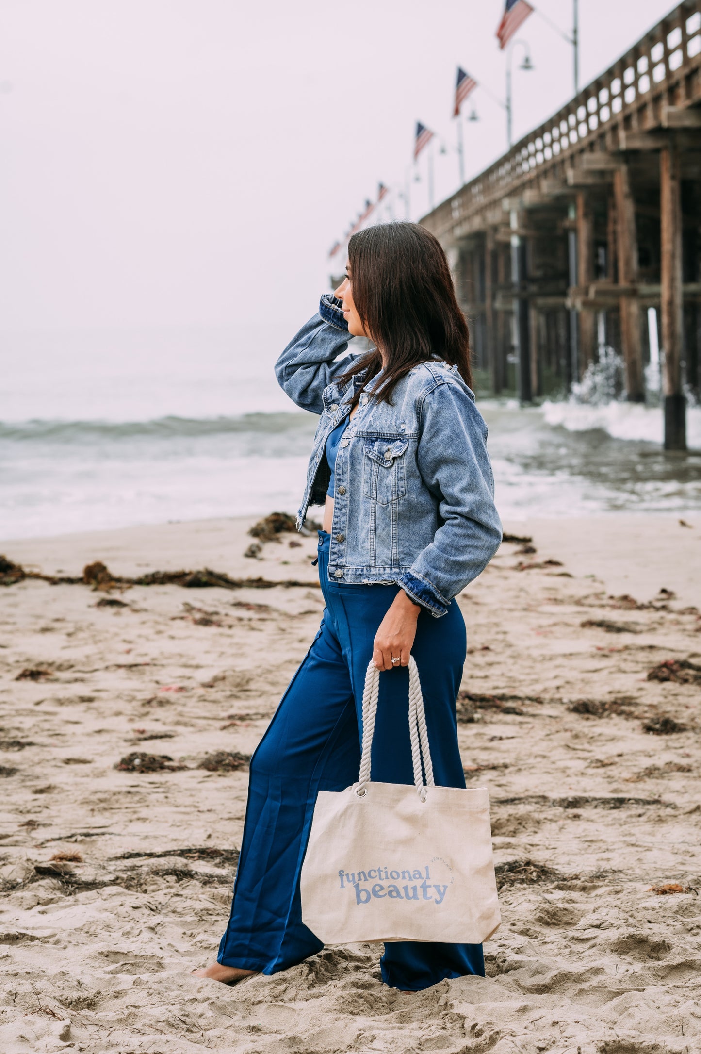 Strolling on beach with canvas beach bag tote