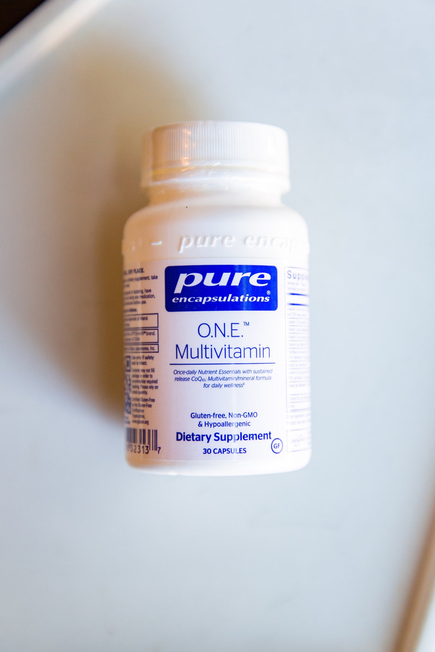 O.N.E. Multivitamin bottle displayed for use